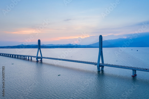 aerial view of cable-stayed bridge at dusk © chungking
