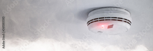 Smoke detector in case of fire alarm as fire protection warning photo