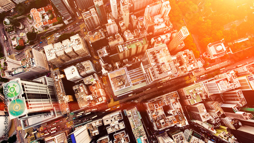 Top view aerial photo from flying drone of a developed China metropolitan with office skyscrapers and business centres. Hong Kong city with tall buildings and development transportation infrastructure