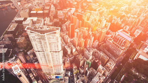 Canvas Print Top view aerial photo from flying drone of a developed metropolis city with tall office skyscraper with modern exterior design