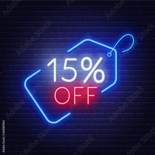 15 percent off neon sign on a dark background .