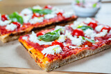 Pizza margarita with cherry tomato, basil and morzzarella cheese