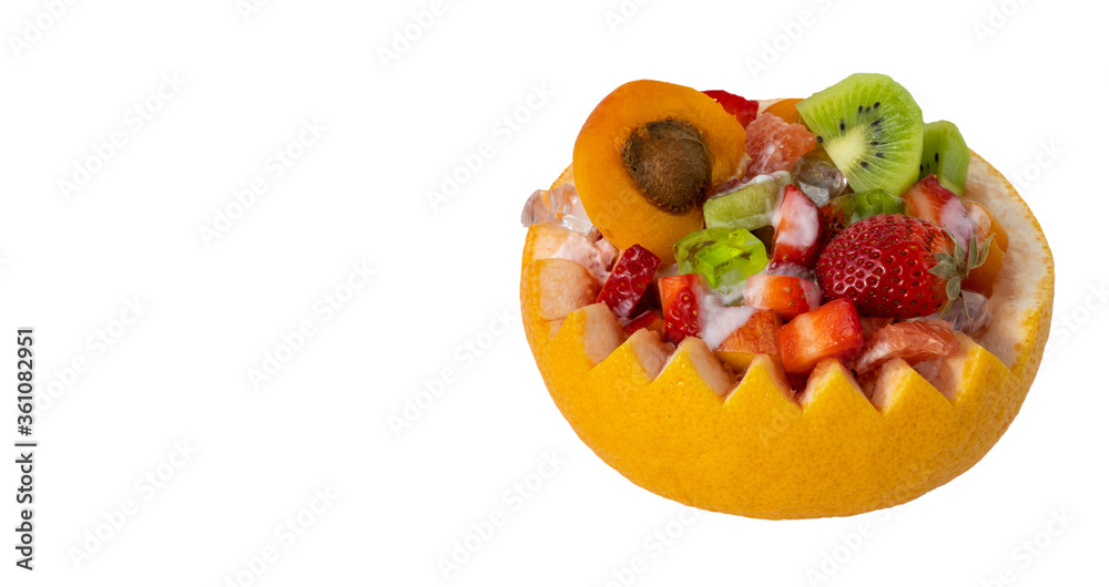 fruit salad in a pot made from grapefruit. fruit food on a white background. healthy and dietary Breakfast, food preparation concept