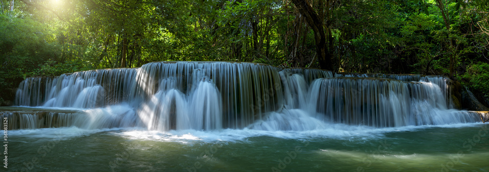 Obraz premium Panoramic beautiful deep forest waterfall in Thailand