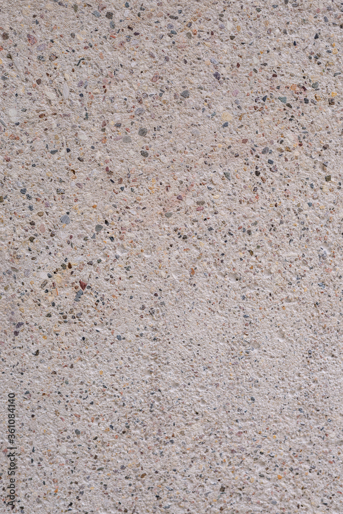 The texture of concrete is ivory with splashes of different colors The texture of concrete is ivory with splashes of different colors