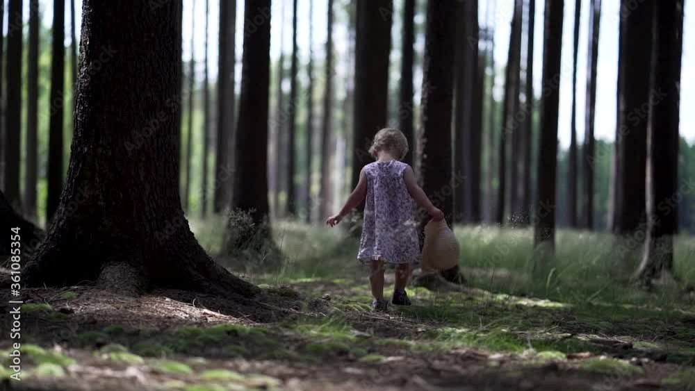 Little girl walking in forrest. Slow-motion Little girl walking in forrest. Slow-motion