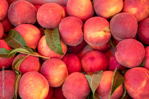 close up view of delicious sweet an ripe peaches in a basket