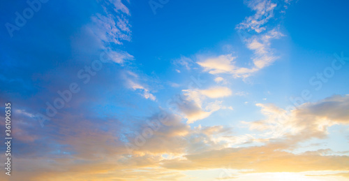 Sunset sky clouds background. Beautiful landscape with clouds and orange sun on sky