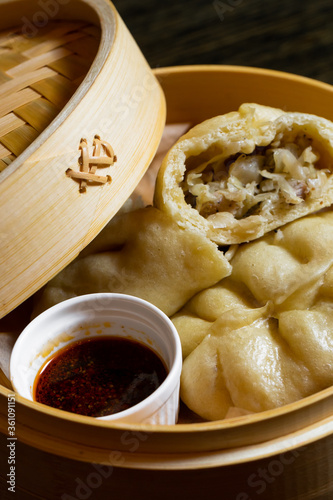 Korean hot pies with meat and sauce on wood table