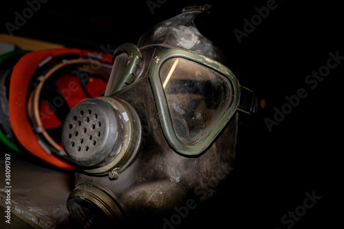 Old gas mask and a red helmut