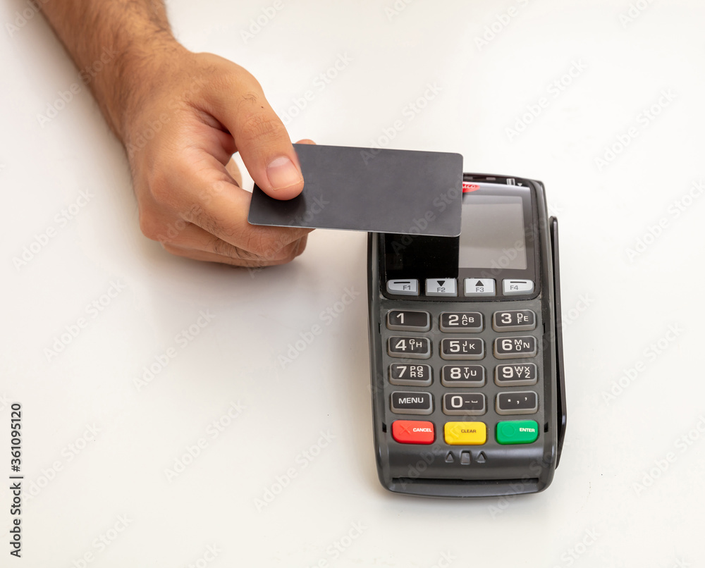 Payment machine, POS terminal and credit card isolated on white background. Payment machine, POS terminal and credit card isolated on white background.