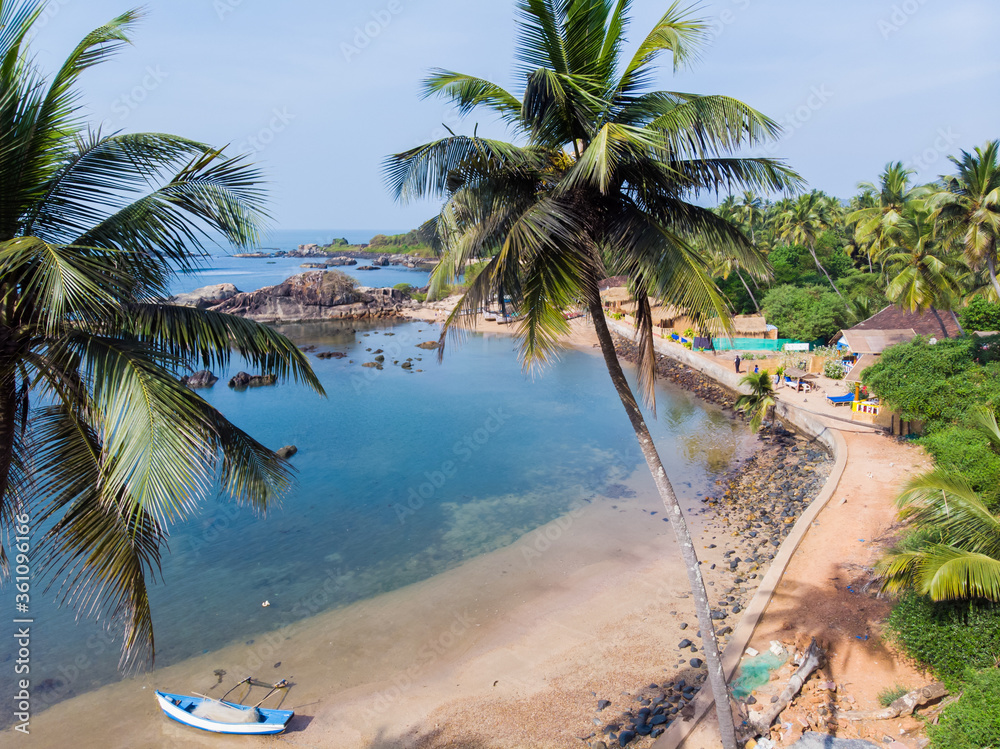 Fotografie Beauty Pathem beach on the background of palm trees