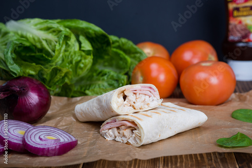 Traditional Mexican food, burritos with chicken, meat and vegetables