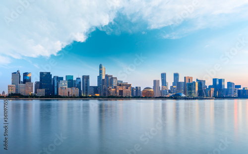 Hangzhou city skyline and architectural reflections at sunrise China.