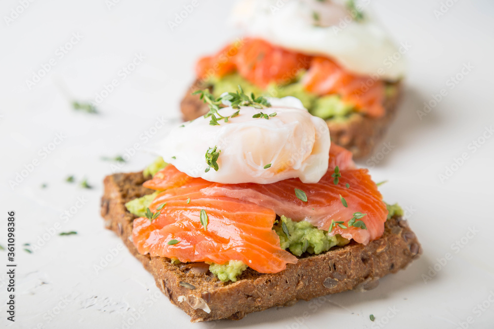 Sandwich with salmon, avocado and whole grain bread Sandwich with salmon, avocado and whole grain bread