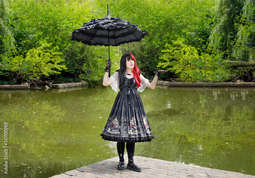 Gothic girl walk in park photo