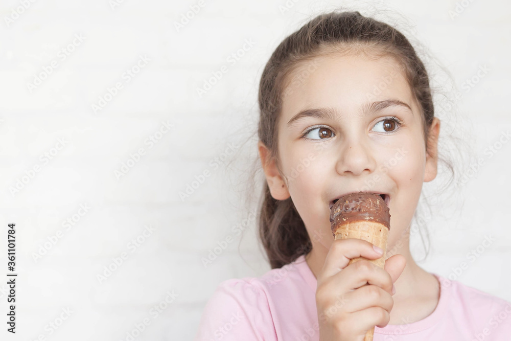 Happy little cute girl eating ice cream Happy little cute girl eating ice cream