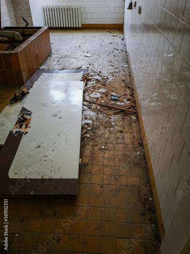 Old wooden hospital doors lying on the ground in old abandoned hospital