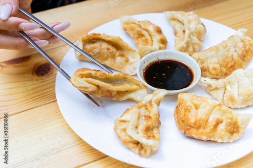 Korean hot pies with meat and sauce on wood table