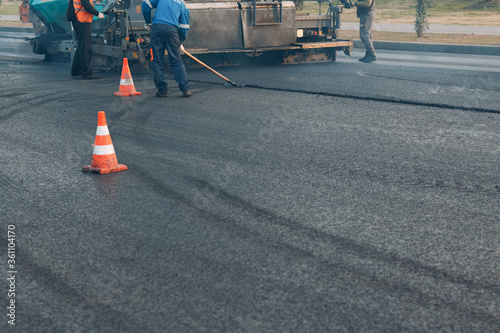 Asphalt paving. Paver machine and road roller. New road construction