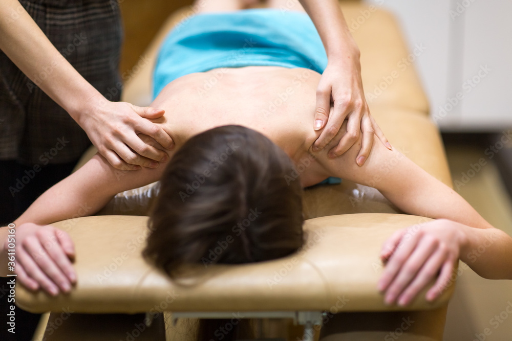 Young woman and back shoulder massage in spa Young woman and back shoulder massage in spa