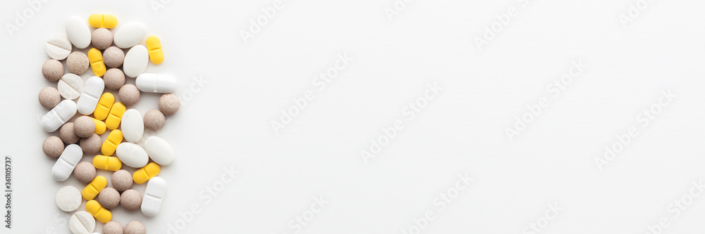 Blank white background with tablets. Place for text. Panoramic photo.