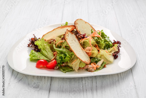 Fresh vegetables salad with croutons and chicken