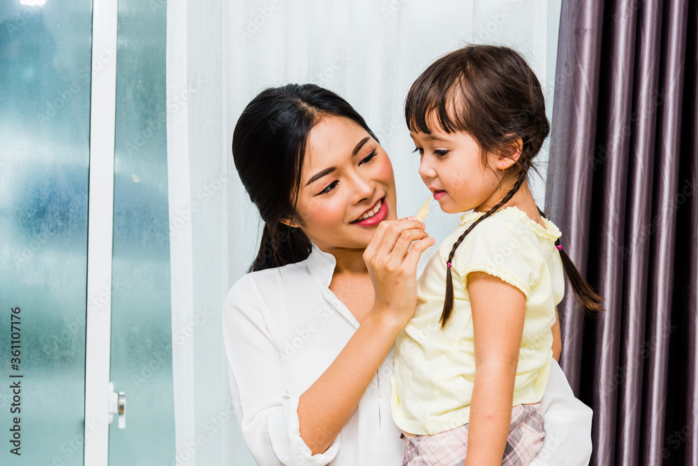 Child kid girl kindergarten and beautiful mother at interior room home Child kid girl kindergarten and beautiful mother at interior room home