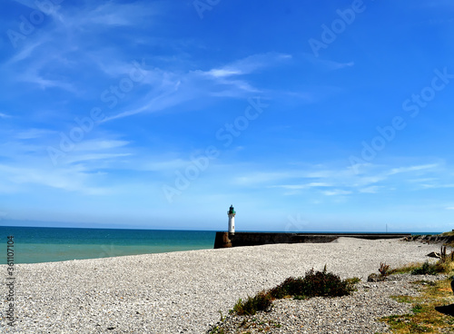 beach and sea with lighthouse