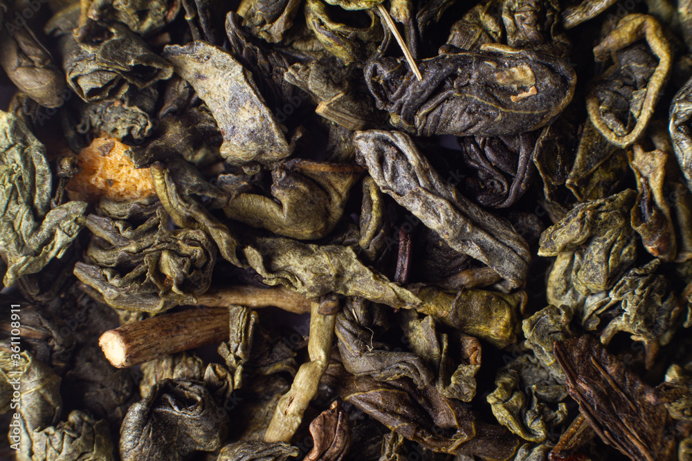 Macro photo of green leaf tea. Chinese tea, oolong, caffeine Macro photo of green leaf tea. Chinese tea, oolong, caffeine