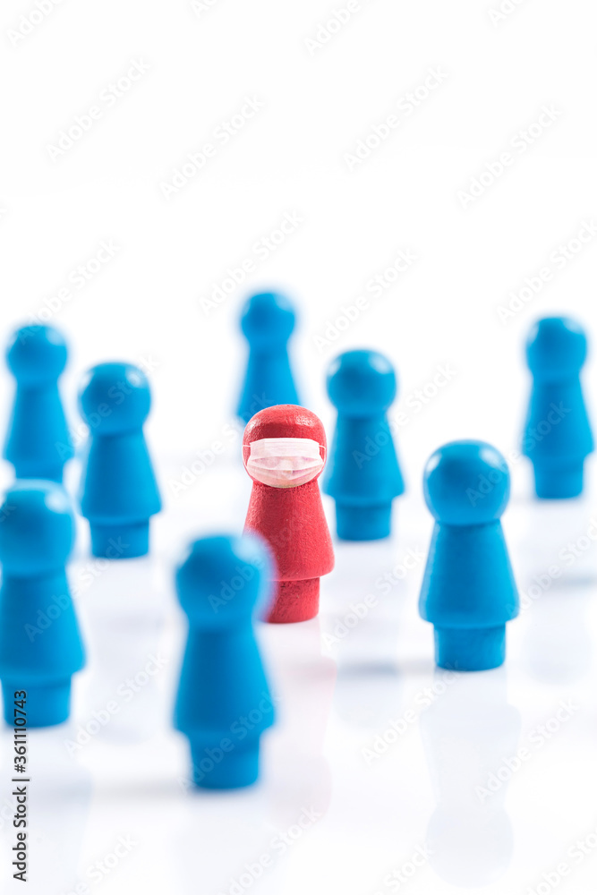 A wooden chess piece shaped like a human figure wearing a mask A wooden chess piece shaped like a human figure wearing a mask