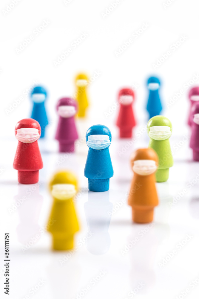A wooden chess piece shaped like a human figure wearing a mask A wooden chess piece shaped like a human figure wearing a mask