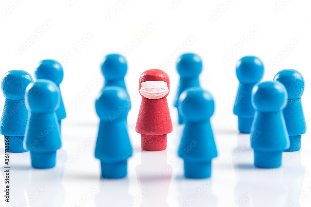A wooden chess piece shaped like a human figure wearing a mask A wooden chess piece shaped like a human figure wearing a mask