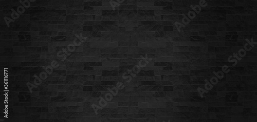The black stone wall pattern texture background.