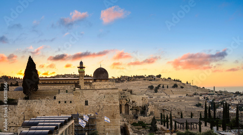 Beautiful sunrise over the Mount of Olives, Al Aqsa Mosque and the Umayyad Palace site at the Jerusalem archaeological park, which includes remains of First and Second Temple, and early Muslim periods photo
