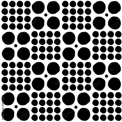 Vector seamless geometric pattern of hand-drawn black circles of different sizes on a white background. For decor, textile, fabric, carpet, wallpaper, ceramic tiles, wrapping.