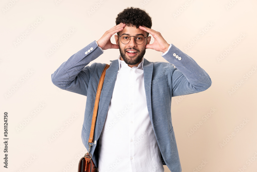 Young business Moroccan man isolated on beige background with surprise expression Young business Moroccan man isolated on beige background with surprise expression