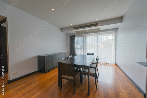 Stylish kitchen interior with dining table and chairs