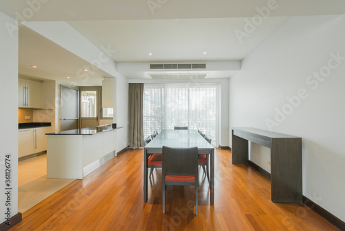 Stylish kitchen interior with dining table and chairs