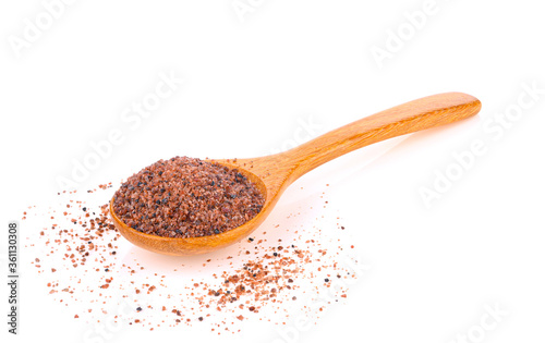 Black salt in wooden spoon