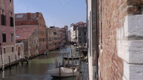 Wallpaper Mural Boats float on one of the many back canals in Venice in Italy.  Torontodigital.ca
