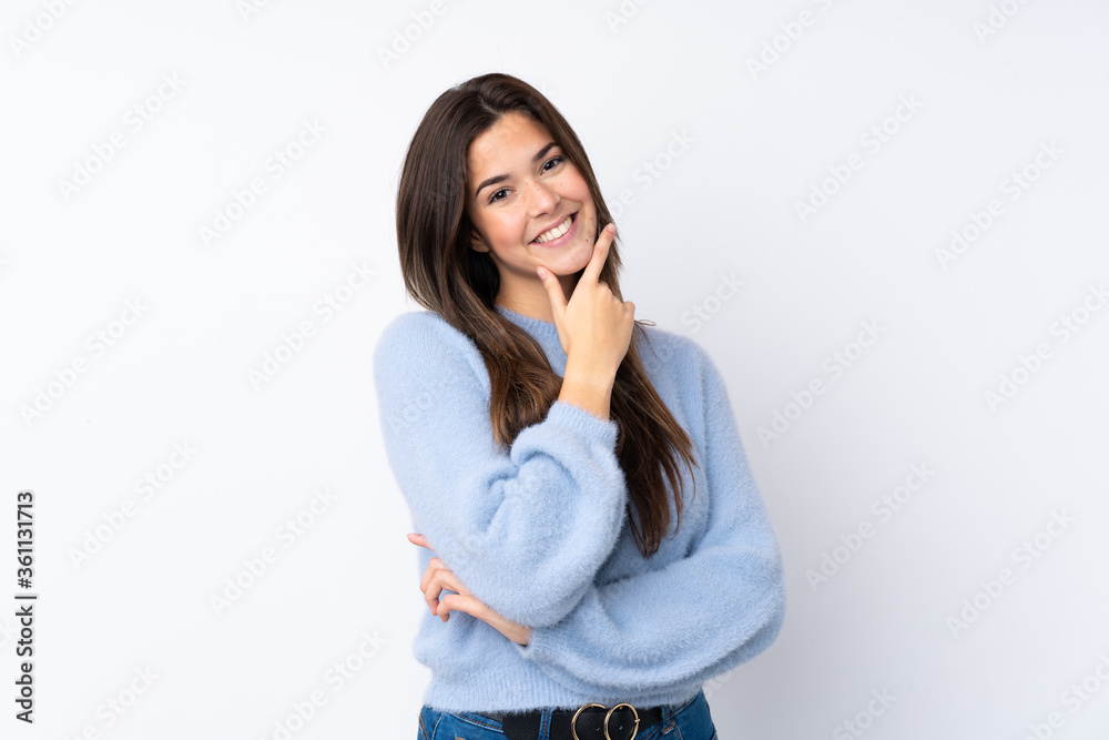 Teenager girl over isolated white background smiling Teenager girl over isolated white background smiling