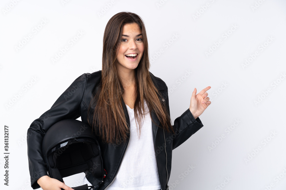 Young woman with a motorcycle helmet over isolated white background pointing finger to the side Young woman with a motorcycle helmet over isolated white background pointing finger to the side