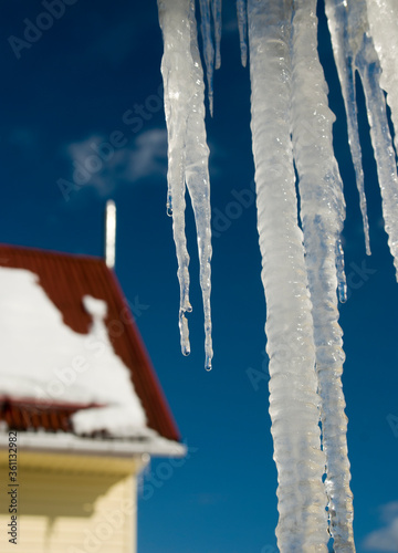 melting icicles under the roof  the arrival of spring