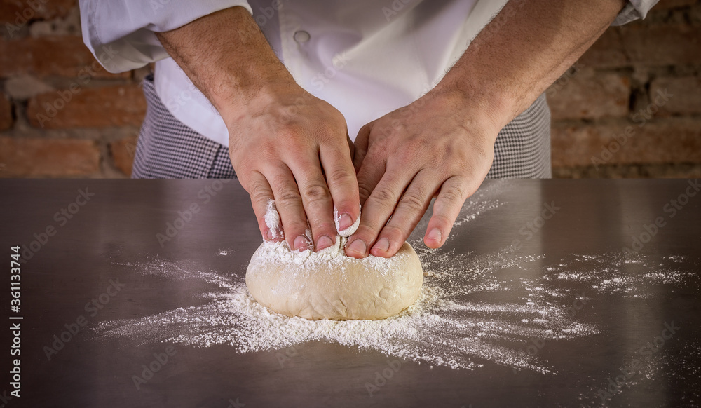 Fresh pizza dough being prepared. The process of making pizza Fresh pizza dough being prepared. The process of making pizza