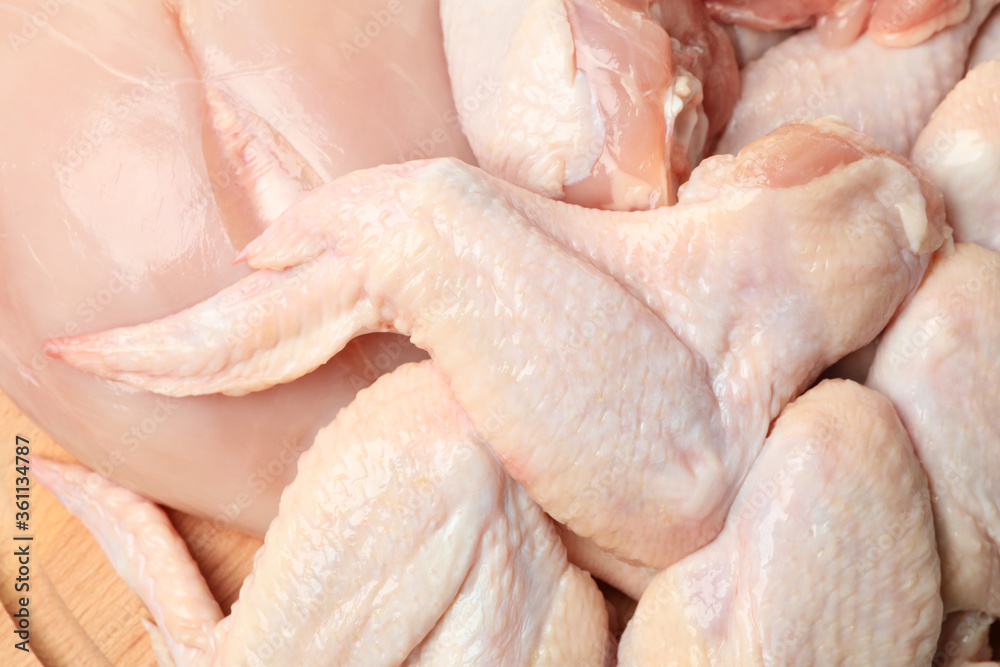 Raw chicken meat on whole background, close up Raw chicken meat on whole background, close up