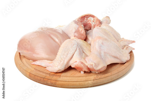 Circle board with raw chicken meat isolated on white background