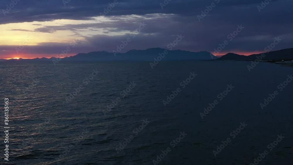 Aerial view flying over the coast near Naples during beautiful sunset Aerial view flying over the coast near Naples during beautiful sunset