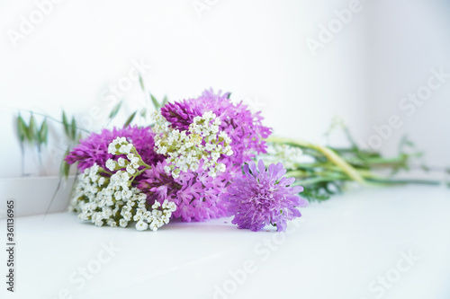 Delicate wild flower bouquet brightens a neutral interior