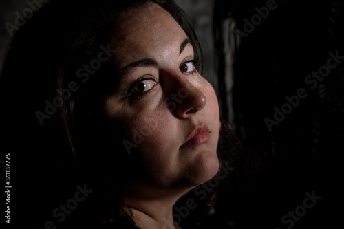 Canvastavla Vintage photo style image of Plus size BBW brunette woman posing in a low key